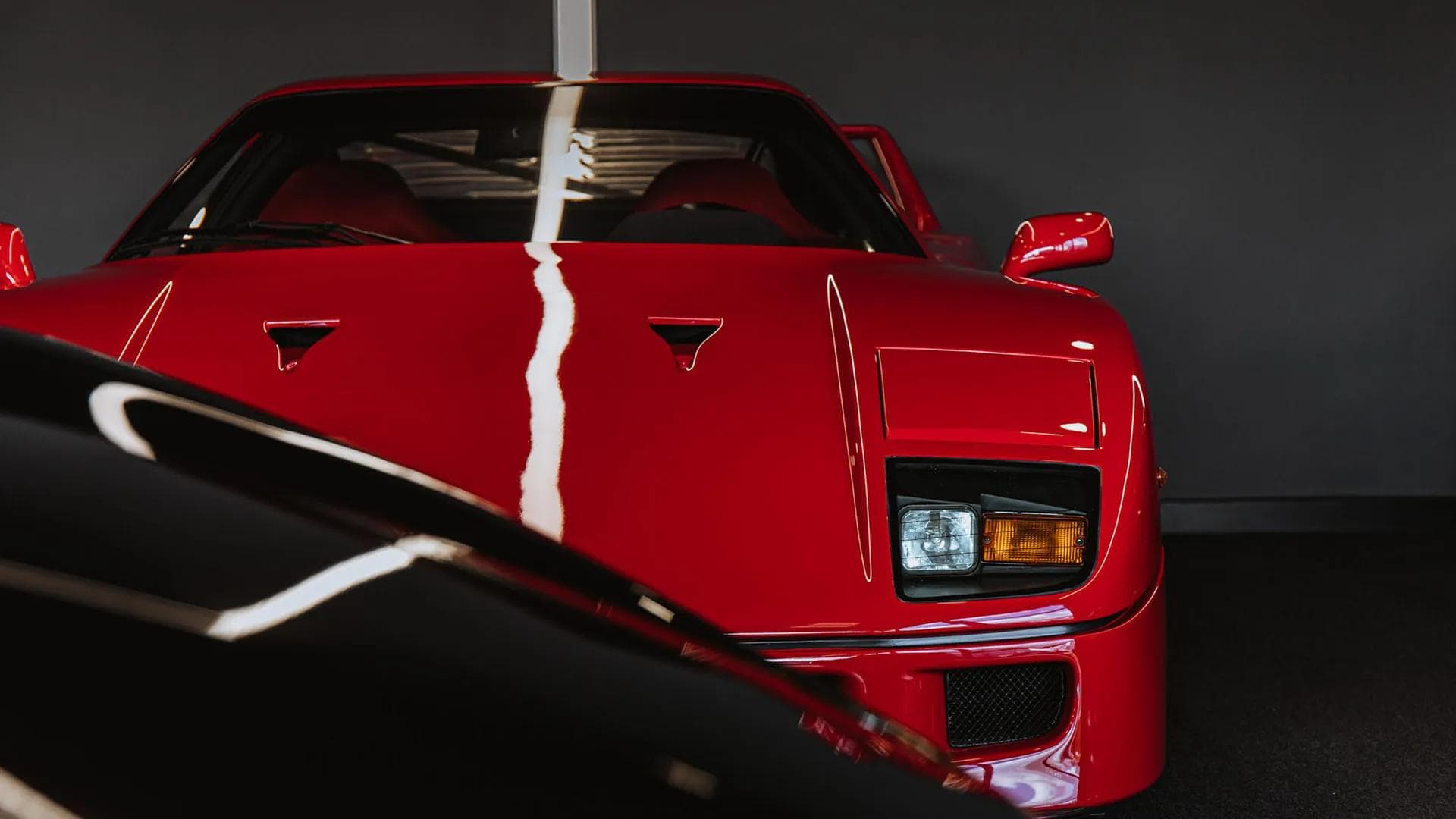 A red Ferrari F40 — we buy supercars